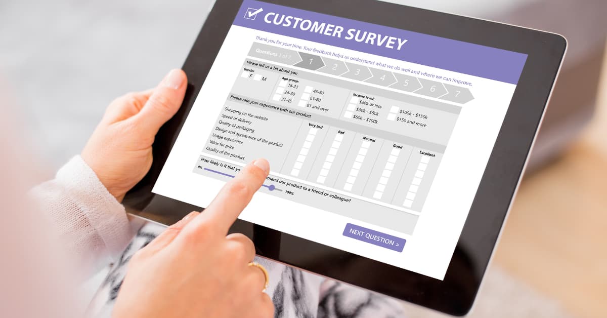 person filling out a feedback form on a tablet