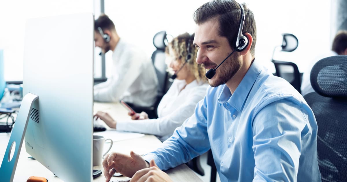 customer support representative with headphones assisting a client